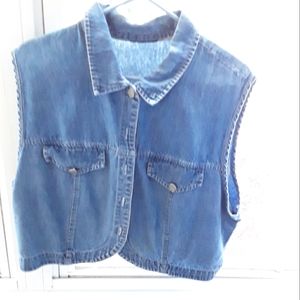 Blue jean (denim) sleeveless vest.  No tags.  Metal buttons. Size medium.